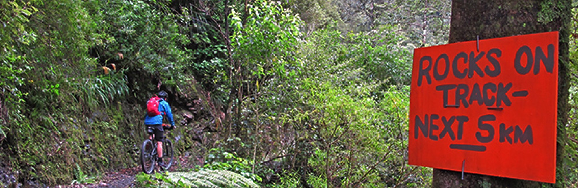 Riding Safely Pakihi Track Rocks Warning Sign credit bennettandslater.co.nz landing
